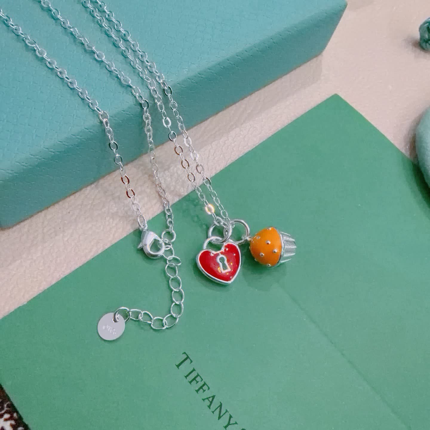 Tiffany & Co. Lock and Key Necklace with Cupcake Charm